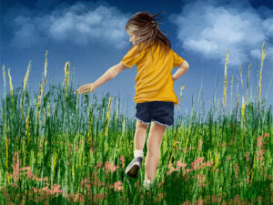 Young girl in a yellow shirt running through tall summer grass, reaching for wildflowers — Painterly Realism digital painting by Shadowmyst Art, Procreate on iPad Pro.