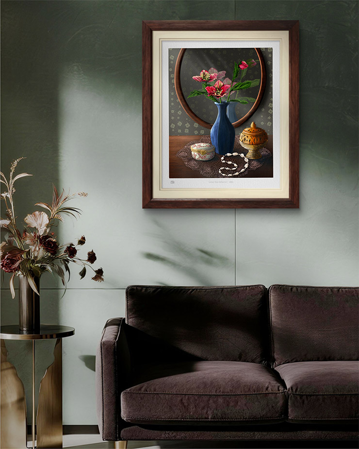 Lenten rose painting by Shadowmyst Art: pink hellebores in a matte blue vase before an oval mirror, with a pink-and-white porcelain trinket box, pierced incense burner, and pearl bracelet on a lace doily against dark floral wallpaper. Digital artwork displayed framed on a pale green wall over a brown couch.